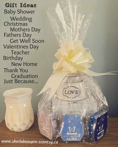 a gift basket with candles and other items for someone's special day or birthday