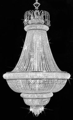 a large chandelier hanging from the ceiling in black and white with lots of crystals