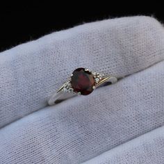 Red Birthstone Ring With Accent Stones, Red Gemstone Accented Round Rings, Red Garnet Birthstone Ring With Accent Stones, Red Gemstone Accented Anniversary Rings, Red Rings With Gemstone Accents For Anniversary, Red Crystal Ring With Stone Setting For Anniversary, Red Birthstone Ring With Gemstone Accents For Anniversary, Anniversary Red Rings With Gemstone Accents, Garnet Crystal Ring For Anniversary