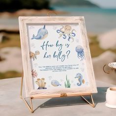 an ocean themed baby shower sign on a table