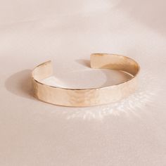 "* Hammered Gold Bracelet, Wide Gold Bangle, Hammered Bangle, Stacking Gold Hammered Cuff, Hammered Gold Bangle, Statement Bangle, Gift for Her * Wide statement hammered cuff handmade and forged with 14/20KT gold-filled material bangle measuring 3/8\" x 6\". * This bangle will arrive in a box tied with a ribbon perfect for gift giving. Also, included will be a polish pad, anti-tarnish tab and a plastic bag for storing. * Please read my policies before placing an order. Convo me if you have any q Adjustable Open Cuff Jewelry For Party, Elegant Hammered Adjustable Cuff Bracelet, Adjustable Hammered Cuff Bracelet, Elegant Adjustable Cuff Bracelet As Gift, Elegant Adjustable Cuff Bracelet For Gift, Adjustable Metal Open Cuff Bracelet, Chic Adjustable Open Cuff Bracelets, Chic Adjustable Open Cuff Jewelry, Bangle Stacking