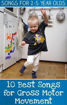 a young boy is jumping in the air with his hands up while holding onto a string