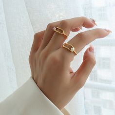 ✦ Indulge in sophistication with our geometric pearl ring, offered in luxurious gold or sleek silver. Plated in radiant 18K gold, this ring boasts a timeless design that combines modern geometric elements with the classic elegance of pearls. Elevate your ensemble with this versatile accessory, perfect for adding a touch of refinement to any look.----------- DETAILS ------------ Color: Gold/ Silver- Ring Size: US 7- Width: 0.6cm- Materials: 18K Gold Plated, Titanium Steel, Pearl- SKU: A201 Modern Gold Pearl Ring For Wedding, Modern Open Pearl Ring For Promise, Gold Minimalist Pearl Ring, Minimalist Gold Pearl Ring With Detail, Modern Yellow Gold Pearl Promise Ring, Minimalist Pearl Open Ring With Simple Design, Modern Wedding Pearl Ring, Elegant Open Band Pearl Ring, Modern Open Pearl Ring For Anniversary