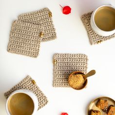 three crocheted coasters and two cups of coffee on a white table top