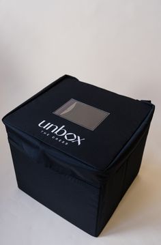 an empty black box with the word unbox on it's front and bottom