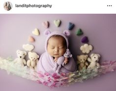 a baby wrapped in a blanket is surrounded by teddy bears and hearts on a purple background