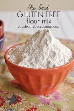 the best gluten free flour mix is in a red bowl on a table