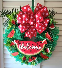 a welcome wreath with watermelon and polka dots