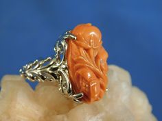 We offer free sizing, free shipping in the USA only, and a free appraisal upon request. If you are an international buyer, please contact us to work out shipping price. Also, we do not pay customs fees. Thanks. Sku: MJ1018 This is a 11.25 ct. Hand-Carved Pink Coral gemstone ring. This is a natural floral Coral in a sterling silver .925 setting. The ring was made in the USA by our staff gemologist and jeweler. Every ring is unique and one of a kind. The beautiful Coral is 14 mm x 22 mm. The total Formal Carved Fine Jewelry Rings, Formal White Gold Carved Jewelry, Orange Polished Wedding Jewelry, Orange Polished Finish Wedding Jewelry, Elegant Carved Orange Jewelry, Elegant Orange Carved Jewelry, Elegant Carved White Gold Rings, Carved Orange Jewelry For Gifts, Carved White Gold Rings For Formal Occasions