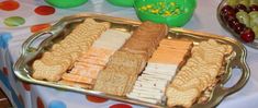 an assortment of crackers and fruit on a table