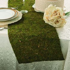 When throwing a wedding full of garden wonder, this table runner is a simple, easy way to add elegance. A fabulous addition to party decorations, use this runner to stylishly accent a buffet table at a rustic wedding. Moss gives you an earthy vibe and beautiful green color while also adding a bit of unexpected texture to your details. Whether you're planning a romantic wedding or a chic birthday party, this table runner can tie your theme together! 14" x 48" | Primrue Moss Table Runner - Party S Enchanted Forest Prom, Moss Table Runner, Moss Table, Enchanted Forest Baby Shower, Party Buffet Table, Enchanted Forest Party, Fairy Baby Showers, Buffet Table Decor, Chic Birthday Party