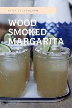 two glasses of wood smoked margarita on a tray