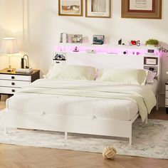 a white bed sitting in a bedroom on top of a hard wood floored floor