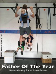 a man is hanging upside down on a rope while two children are sitting in front of him