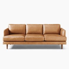 a tan leather couch against a white background