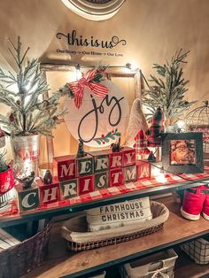 a christmas display in a store with red and white decorations on the shelf next to it