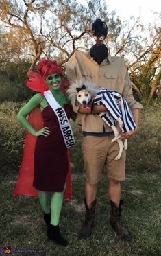 a man and woman in costumes standing next to each other