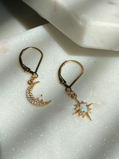 Moon and Star Opal Earrings-Gold Filled Earring Clasps-Dangle Earrings-Celestial Earrings-Gold Moon Earrings-Gold Star Earrings-Opal Earring~~~~~~~~~~~~~~~~~~~~~~~~~~~~~~~~~~~~~ITEM DETAILS* * Gold Plated Opal Moon 8x13mm* * Gold Plated Opal Star 10x13mm* * 14k Gold Filled Leverback earrings🔔✨🔔 Claim your 10% Coupon by signing up to our mailing list (copy and paste link on URL) https://www.subscribepage.com/pinkslate  🔔✨🔔--SHIPPING DETAILS--*No Invoices are included in the package*If standar Celestial Dangle Earrings With Star Charm, Celestial Style Dangle Earrings With Star Charm, Celestial Star-shaped Earrings For Pierced Ears, Celestial Star Shaped Earrings With Sun And Moon Design, Celestial Star-shaped Earrings With Sun And Moon Design, Celestial Star Charm Round Earrings, Crescent Earrings With Star Charm As Gift, Crescent Earrings With Star Charm For Gift, Crescent Shaped Earrings With Star Charm For Gift