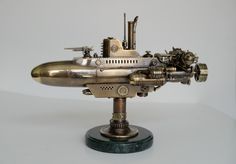 an antique model of a jet engine on a stand