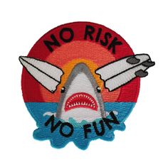 a patch with a shark and plane on it that says no risk, no fun