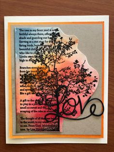 a card with an image of a tree and the words love written in black on it