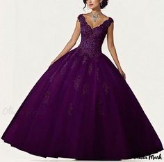 a woman in a purple ball gown