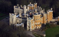 an aerial view of a castle in the woods