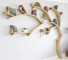 a tree shaped shelf with books on it