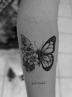 a black and white photo of a butterfly with flowers on it's leg, next to an instagram page