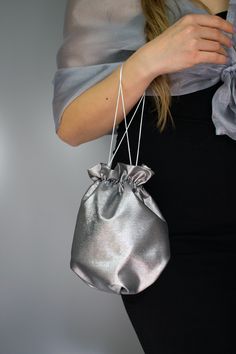 Elegant satin bag / money bag / purse ! Ideal for your wedding day, night out, party ,special occasion Made of beautiful silver grey bridal taffeta fabric. You can change colors Fabric : taffeta Lining : poliester Size : approx. 18 cm x 18 cm Elegant Gray Pouch Bag, Elegant Metallic Bag For Gift, Elegant Metallic Bag As Gift, Elegant Metallic Bags For Gifts, Silver Pouch Evening Bag As Gift, Silver Pouch Evening Bag For Events, Silver Evening Pouch, Elegant Gray Bag For Gift, Silver Clutch Evening Bag As A Gift