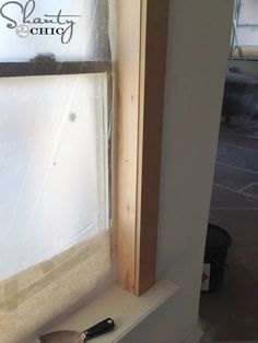 a window sill with a knife on top of it