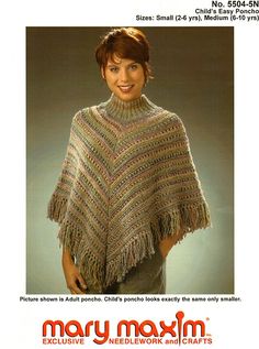 a woman wearing a knitted shawl with fringes