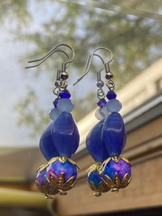 Beautiful beaded earrings with gorgeous dark blue and pink/gold accents Blue Bohemian Beaded Earrings With Large Beads, Bohemian Blue Beaded Earrings With Large Beads, Blue Large Beaded Dangle Earrings, Blue Large Beads Dangle Earrings, Blue Teardrop Jewelry With Colorful Beads, Blue Large Beaded Drop Earrings, Blue Beaded Drop Earrings With Large Beads, Blue Large Beads Drop Earrings, Blue Bohemian Beaded Earrings For Pierced Ears