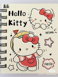 an open notebook with hello kitty drawings on it