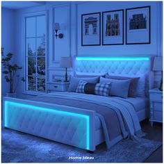 a bed with blue lights on the headboard and foot board is in a bedroom