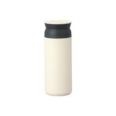 a white and black bottle on a white background with a black cap in the shape of a canister