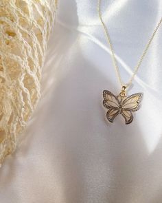 Give her the gift of wings with this beautiful butterfly necklace. DETAILS - 14k yellow gold butterfly with rhodium plating - Chain option is a 14k yellow gold cable chain - Chain style may vary slightly - Approximately 3/4 inch wide x 3/4 inch tall (including bail) VARIATIONS If you require any variation of this style (a different style chain, longer chain, etc.) feel free to message us. We will do our best to accommodate you. Additional costs may apply depending on the variation. POLICY We do Sterling Silver Yellow Gold Butterfly Pendant Necklace, Yellow Gold Pendant Jewelry With Butterfly Clasp, Butterfly Shaped Yellow Gold Sterling Silver Jewelry, Yellow Gold Butterfly-shaped Sterling Silver Jewelry, Yellow Gold Sterling Silver Butterfly Jewelry, Sterling Silver Yellow Gold Butterfly Necklace, Yellow Gold Sterling Silver Butterfly Necklace, 14k White Gold Butterfly-shaped Jewelry, 14k White Gold Butterfly Jewelry