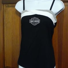 a women's black and white tank top with the harley davidson logo on it