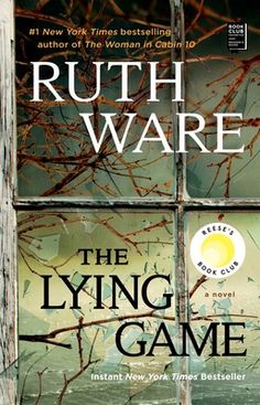 the lying game by ruth waree is shown in front of a window with trees outside