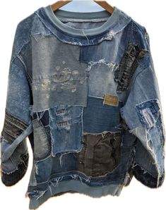 an old blue jean jacket with patches on it