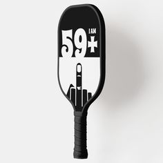 a black and white paddle with the number fifty five on it