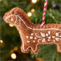 a brown ornament hanging from a christmas tree