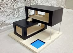 a black and white table with a blue square on it