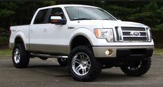 a white truck parked in a parking lot