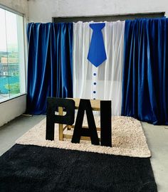 a chair with a tie on it and the word pai spelled out in front