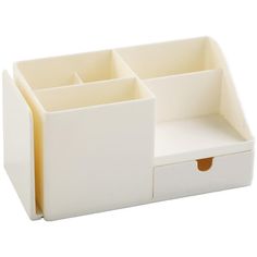 a white desk organizer with three compartments