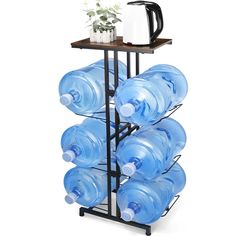 a rack with water bottles and a coffee mug on it, holding a tray for cups