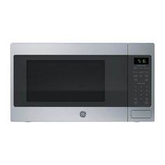 a stainless steel microwave oven with the door open and clock on it's side