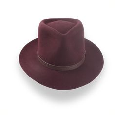 Description Materials Craftsmanship Hat Care Shipping Returns Product Description A Burgundy Western Fedora in Outback Style Step into adventure with the Compass, a burgundy Western fedora handcrafted from luxurious rabbit fur felt. Featuring a distinctive teardrop crown and a broad 3" brim, this hat provides both sun protection and unmatched style. Custom-made to fit your exact head size, the Compass allows for personalization with a choice of hatbands, including a stylish leather belt. Deliver Homburg, The Compass, Hat Box, Formal Casual, Head Shapes, And So The Adventure Begins, Rabbit Fur, Green Fashion, Cotton Bag