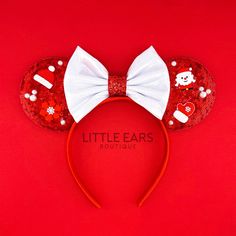 a red minnie mouse ears with white bows